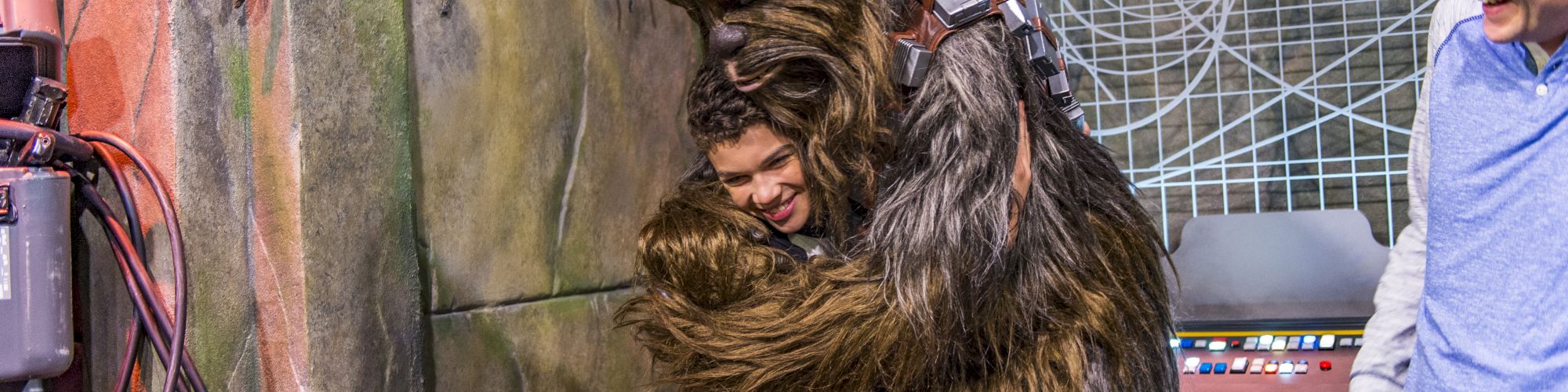 Chewbaca hugging child at DISNEYLAND&reg; Resort